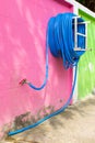 Water hose winder wall pink. Royalty Free Stock Photo