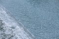 Water and ice shore. Cold ripple pond and frozen coast