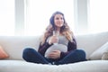 Water is important during pregnancy. Full length shot of an attractive young pregnant woman drinking water while sitting Royalty Free Stock Photo