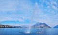 Water Jet on the bay of Lugano fountain, Lake Lugano, Switzerland Royalty Free Stock Photo