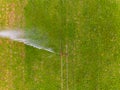 Water jet of sprinkler of irrigation on a field seen from the air