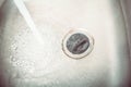 Water Jet Streaming In A Sink With Set Drain Plug Royalty Free Stock Photo
