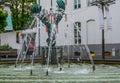 Water jets of a city fountain with bird statue in antwerp, Antwerpen, Belgium, April 23, 2019