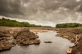 Water of Ken flowing out of a gorge on a drained or dewatered Earlstoun Dam Royalty Free Stock Photo