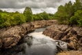 Water of Ken river flowing through a rocky gorge near Dalry, Galloway, Scotland Royalty Free Stock Photo