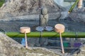 Water and ladles hishaku for the ceremonial washing of hands rite temizu, Japan Royalty Free Stock Photo