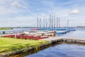 Water landscape with blue sailboats