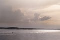 Water landscape. A large reservoir in the rays of the setting sun.