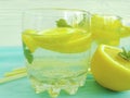 Water with lemon, mint fresh ingredient vitamin on a wooden background Royalty Free Stock Photo