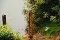 The water level column is located on the river, the concept of checking the water resources Royalty Free Stock Photo