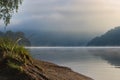 Water level between hills in early fog Royalty Free Stock Photo