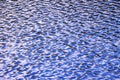 Water level, water in motion. Reflected structure of the surroundings is distorted by the movement of water. Abstract blue backgro Royalty Free Stock Photo