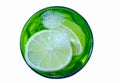 Water with lime pieces in the green glass