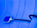Water or liquid level sensor with float switch in a large blue plastic container Royalty Free Stock Photo