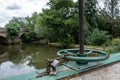 Water lock gate control gears with cogwheels on canal with waterfall