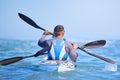 Water, man and woman in kayak from back and sports on lake, beach or river for exercise team. Ocean holiday, adventure Royalty Free Stock Photo