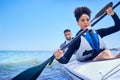Water, man and woman in kayak at ocean for race at lake, beach or river, exercise in sport. Holiday, adventure and Royalty Free Stock Photo
