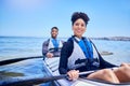 Water, man and woman in kayak for race at lake, beach or river for exercise in sports at sea. Ocean holiday, adventure Royalty Free Stock Photo