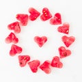 Water melon cut into heart shape on white background. Love concept. Valentine`s Day Concept. Flat lay, Top view Royalty Free Stock Photo