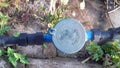 Water meter,black pipe on concrete floor. Royalty Free Stock Photo