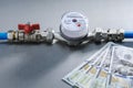 Water meter and dollars money banknotes . Royalty Free Stock Photo
