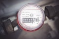 Water meters are installed on the pipe and sealed, a flow meter and a tap of the heating system valves in the boiler room of a