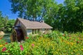 Water mill and flowers