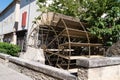 Water mill wheel on city canal L`Isle-sur-la-Sorgue Vaucluse France Royalty Free Stock Photo