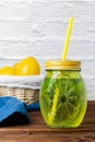 Water with mint in a yellow glass Royalty Free Stock Photo