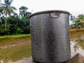 Water mug near the pond in a rainy day