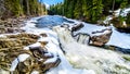 The Murtle River tumbles over the edge of the partly frozen Mushbowl Falls in BC, Canada