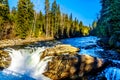 Water of the Murtle River tumbles over the edge of Whirlpool falls in the Cariboo Mountains of Wells Gray Provincial Park