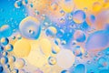 Water oil bubble macro abstract background flow liquid blue aqua yellow pink red colors