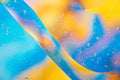 Water oil bubble macro abstract background flow liquid blue aqua yellow pink red colors