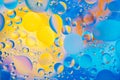 Water oil bubble macro abstract background flow liquid blue aqua yellow pink red colors