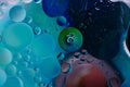 Water oil bubble macro abstract background flow liquid blue pink green Royalty Free Stock Photo