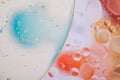 Water oil bubble macro abstract background flow liquid blue white aqua red orange colors Royalty Free Stock Photo