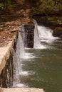 Water over dam at grist mill Royalty Free Stock Photo