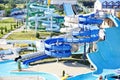 Water Park on the beach on a Sunny morning. Rides in the form of spiral pipes.