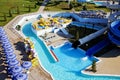 Water Park on the beach on a Sunny morning. Rides in the form of spiral pipes.