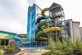 water park with flume water slide, twisting and turning its way down the side of the building