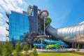 water park with flume water slide, twisting and turning its way down the side of the building
