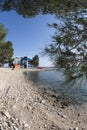 Water park and pine tree at the sand beach in Crikvenica Royalty Free Stock Photo