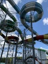 Water park slides against the blue sky. Modern water park with colorful slides. Summer Amusement Park, water attraction Royalty Free Stock Photo