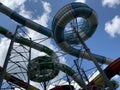 Water park slides against the blue sky. Modern water park with colorful slides. Summer Amusement Park, water attraction Royalty Free Stock Photo