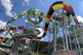 Water park slides against the blue sky. Modern water park with colorful slides. Summer Amusement Park, water attraction Royalty Free Stock Photo