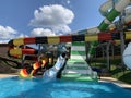 Water park slides against the blue sky. Modern water park with colorful slides. Summer Amusement Park, water attraction Royalty Free Stock Photo