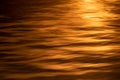 Water pattern in red sunset, nature detail background with waves Royalty Free Stock Photo