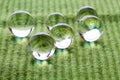 Water Pearls on green cloth Royalty Free Stock Photo