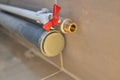 Water pipe with faucet and sewer pipe with a plug, closeup